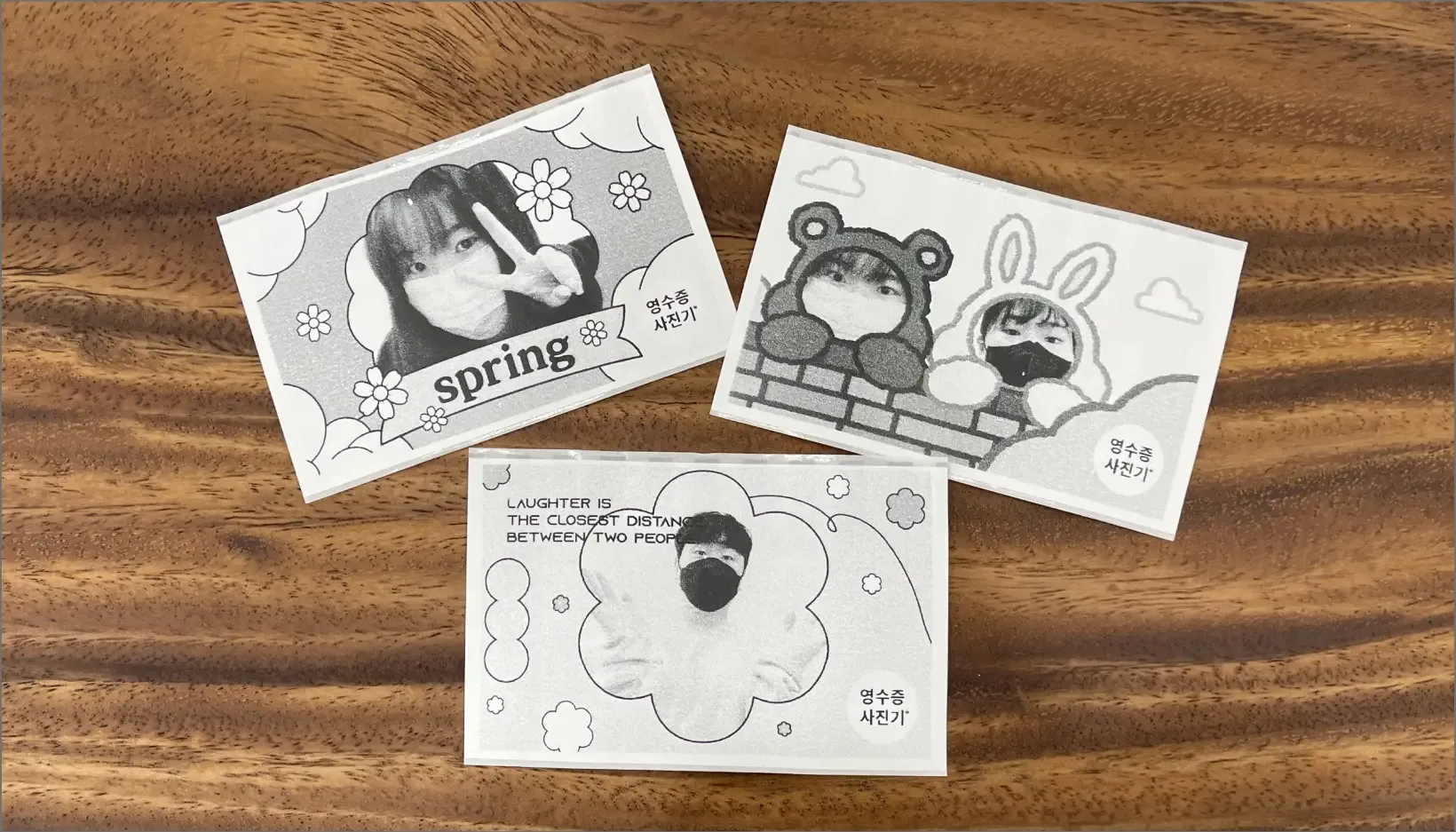 나무 테이블 위 일러스트 프레임을 적용한 영수증사진 3장(spring, 곰·토끼 캐릭터, LAUGHTER IS 문구)